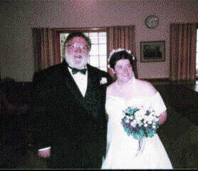 The new Bride and Groom get ready  to leave the 
Wedding Hall and face all those people outside holding Birdseed.  
And we're off to the Reception.