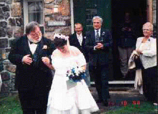 Tina and I barely make it out the door through a shower
of Birdseed.  Whos Idea of Throwing rice at the Bride and Groom was 
it?